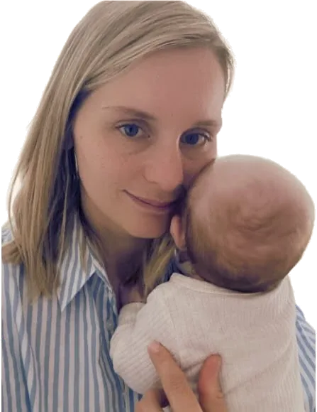 Ashleigh, founder of Kiddi Kleen, cuddling her baby