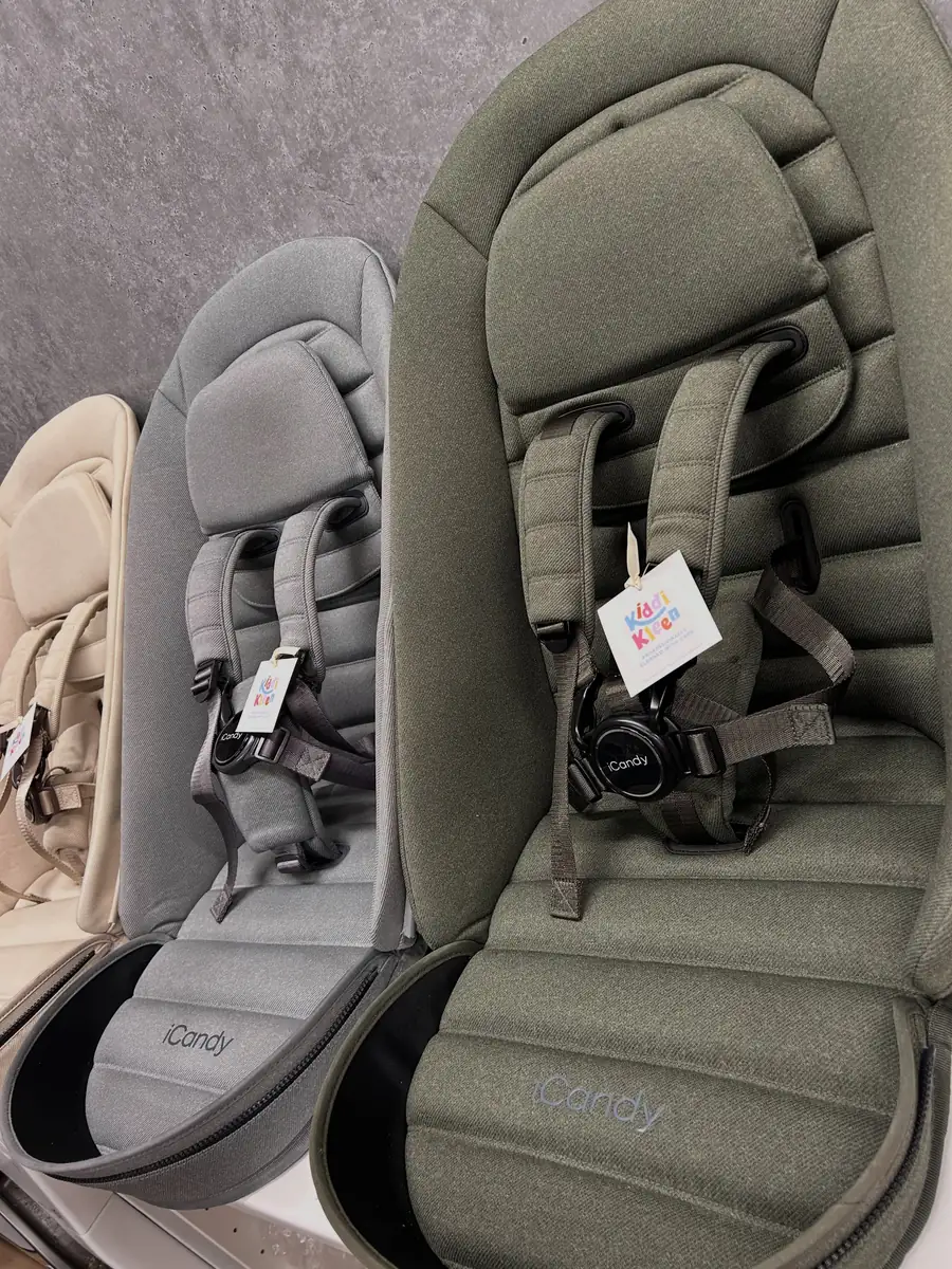 Three iCandy seat units lined up after cleaning, each with a Kiddi Kleen tag